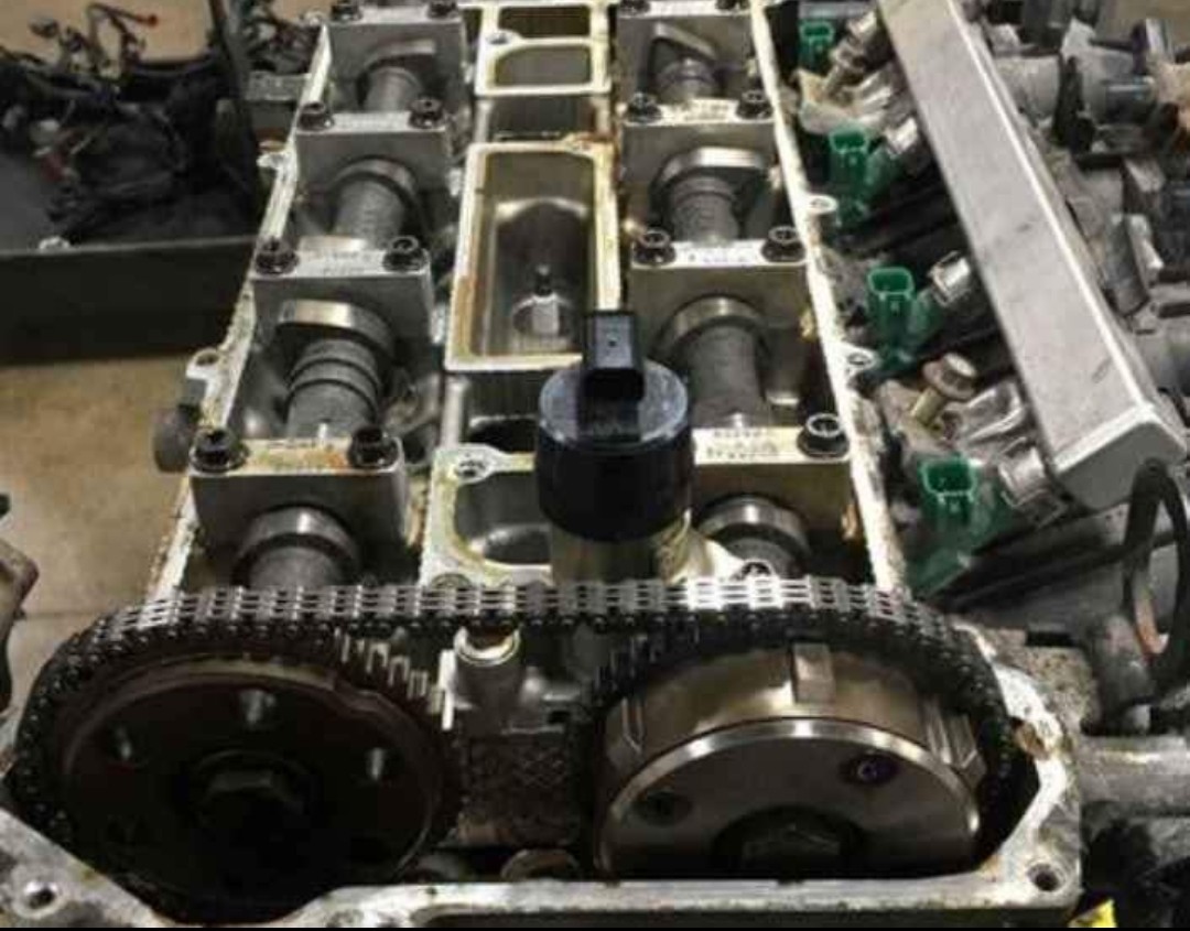 Cylinder head with timing chain exposed during an engine repair