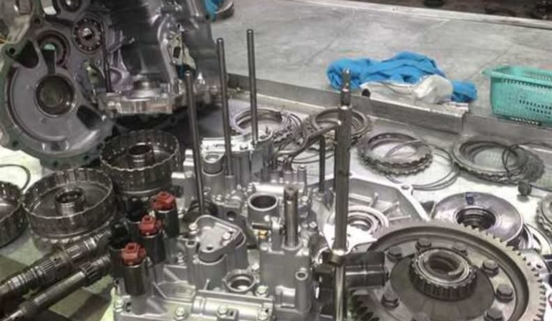 Transmission parts laid out on a bench