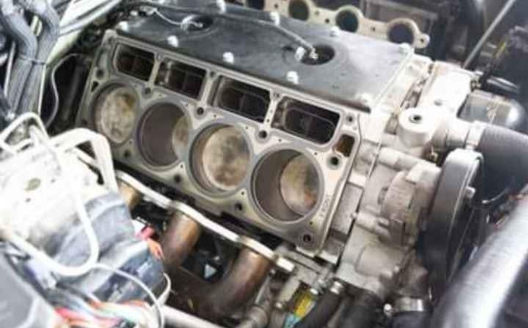 Engine with the cylinder head off, cylinders visible