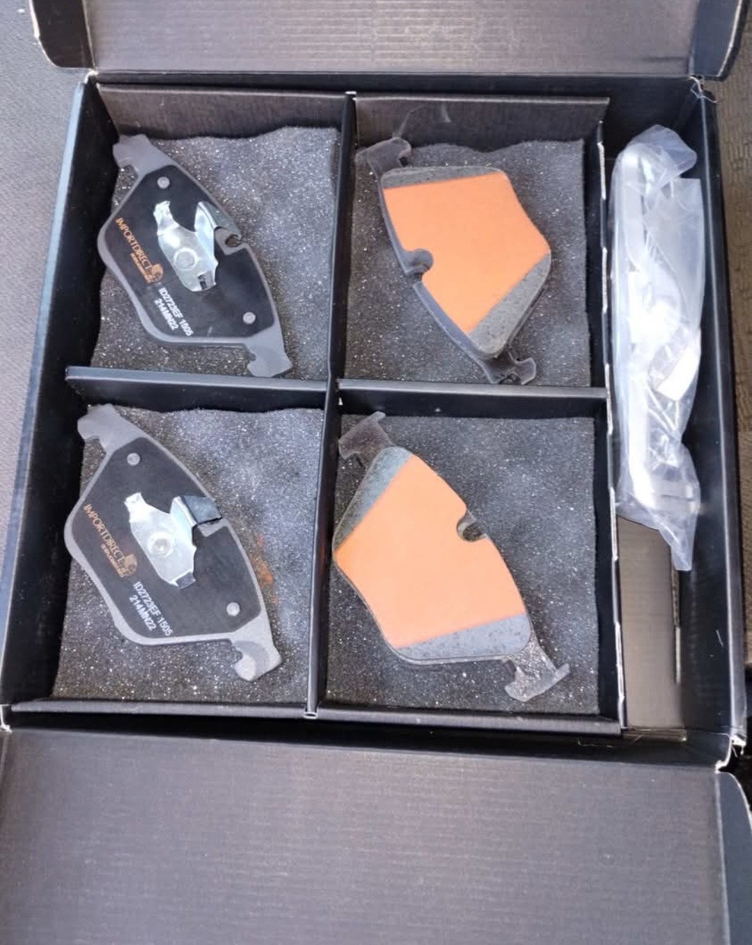 A boxed set of new brake pads